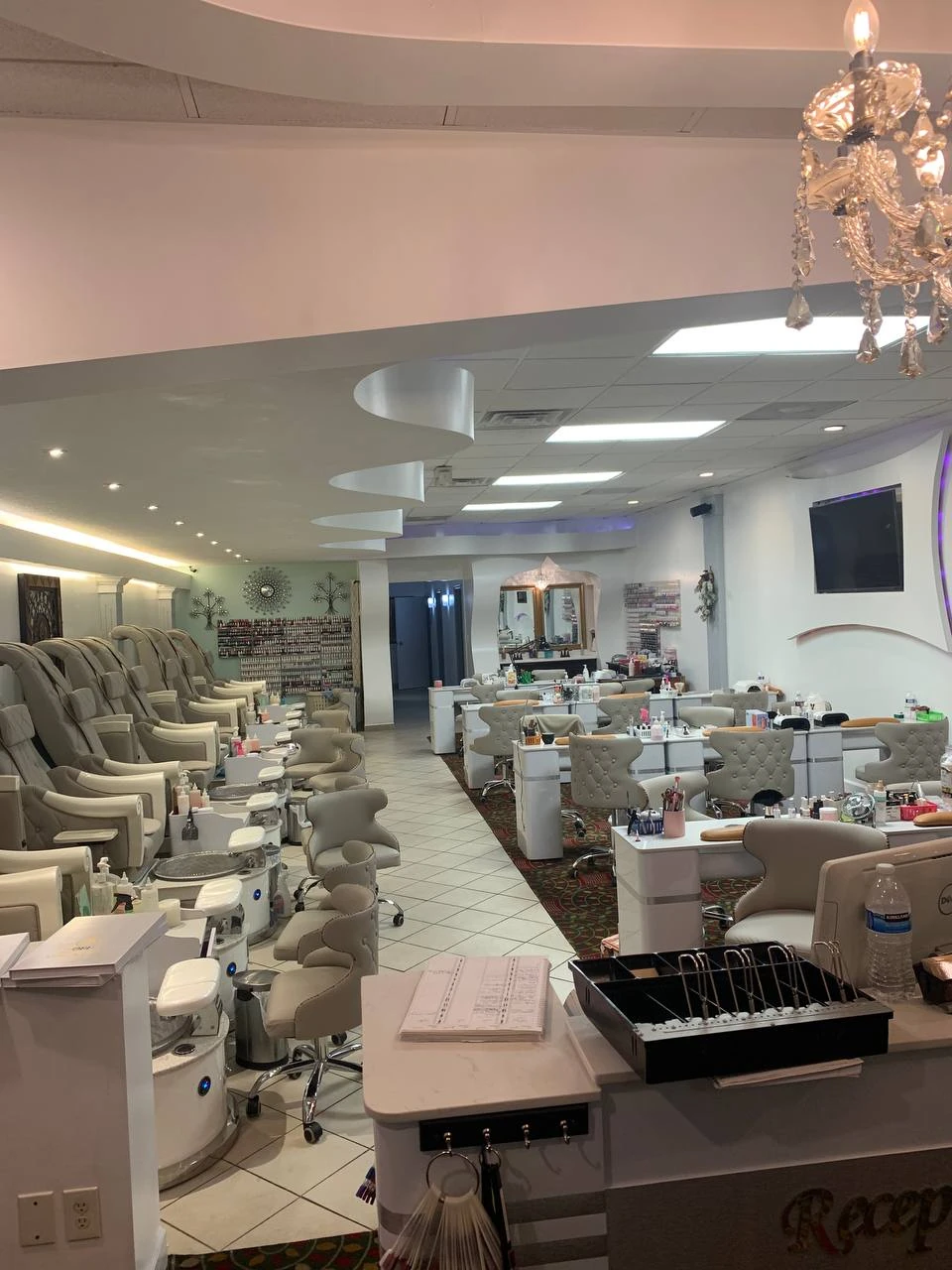 Solar Nails salon interior with spa pedicure chairs and manicure stations.
